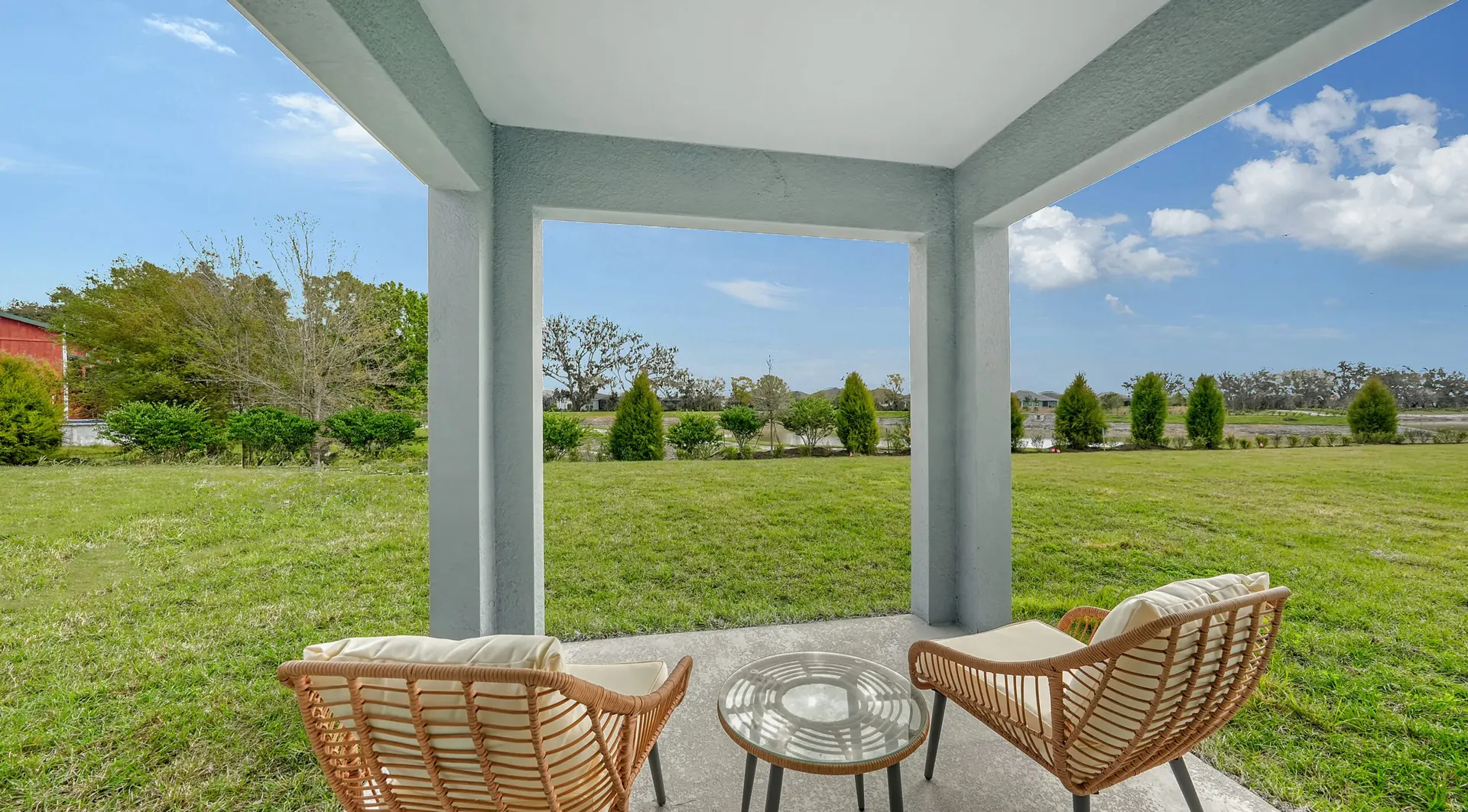 Covered patio overlooking the backyard at Broadleaf